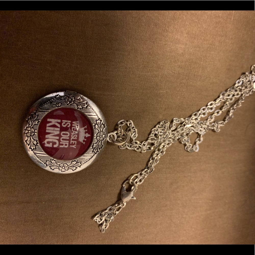 Weasley is our king locket necklace.  Never worn.